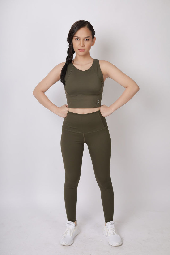 A lady wearing Beauty Lyfe Activewear Elisse Model Olive Green sports bra and in leggings
