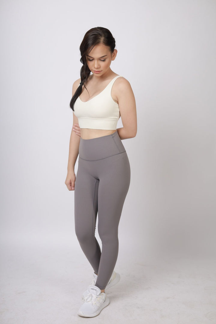 A lady wearing Beauty Lyfe Activewear Scarlett Model Dark Gray Leggings and in sports bra