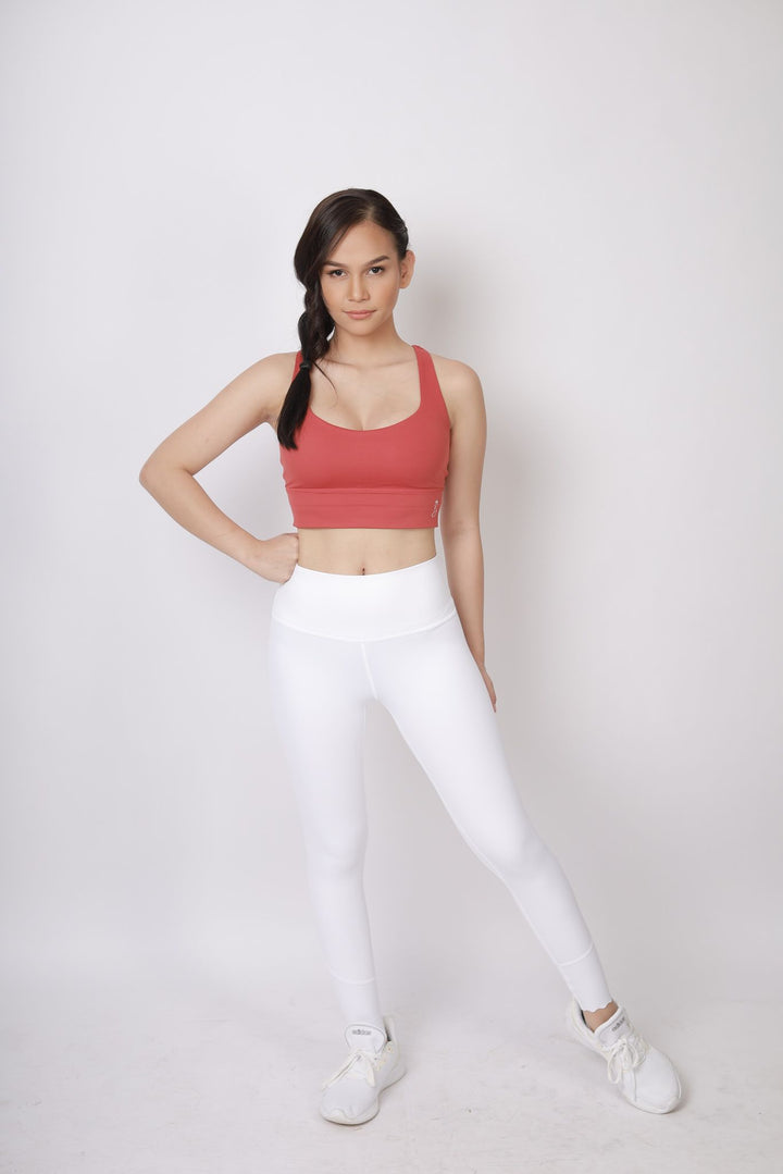 A lady wearing Beauty Lyfe Activewear Charm Model White leggings and in sports bra