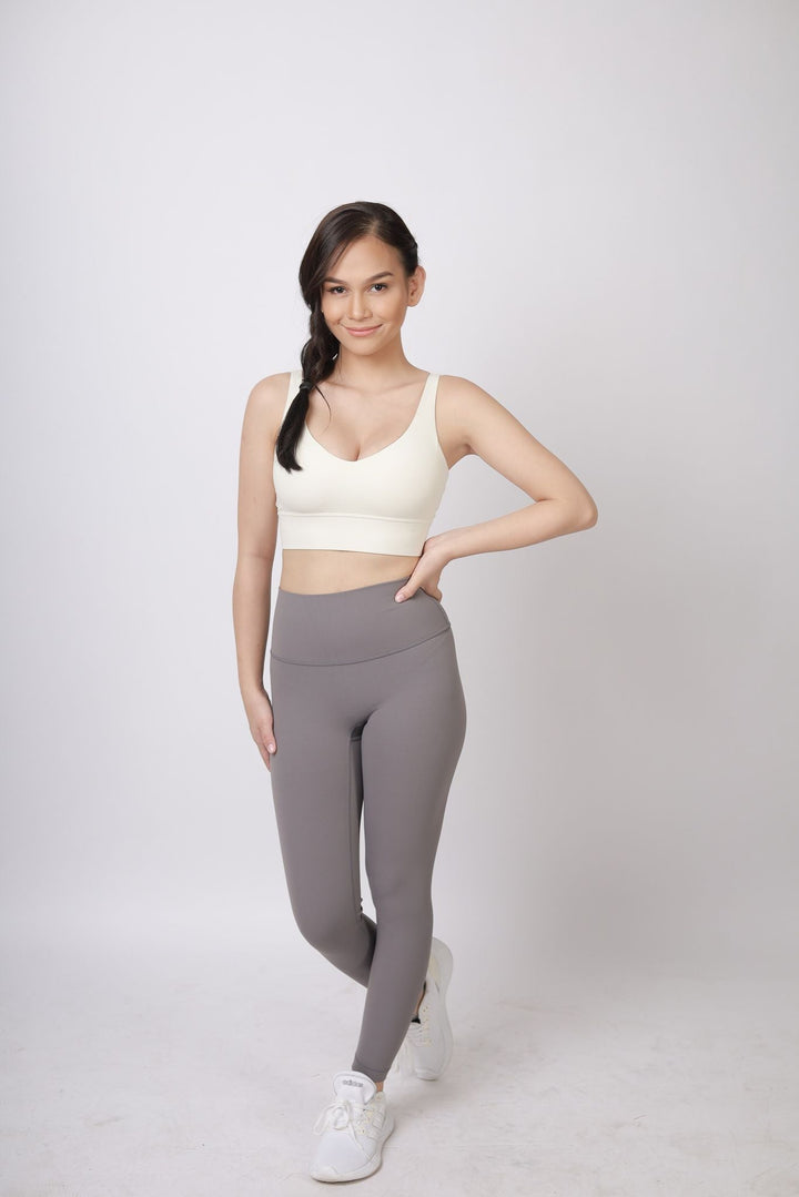 A lady wearing Beauty Lyfe Activewear Scarlett Model Dark Gray Leggings and in sports bra