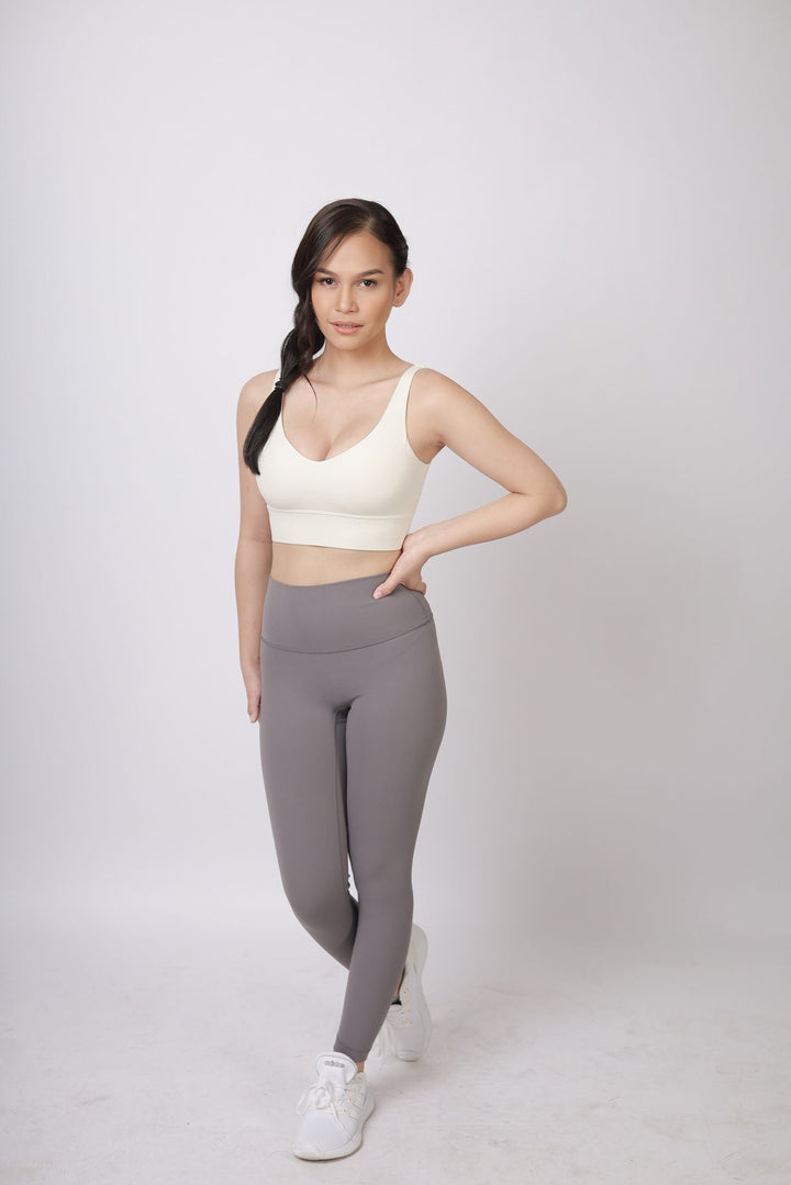 A lady wearing Beauty Lyfe Activewear Scarlett Model Dark Gray Leggings and in sports bra