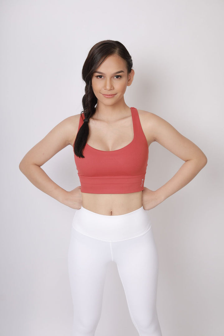 A lady wearing Beauty Lyfe Activewear Charm Model White leggings and in sports bra