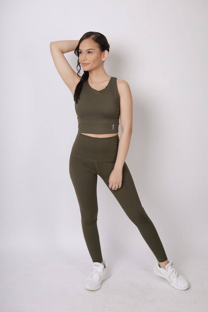 A lady wearing Beauty Lyfe Activewear Elisse Model Olive Green sports bra and in leggings