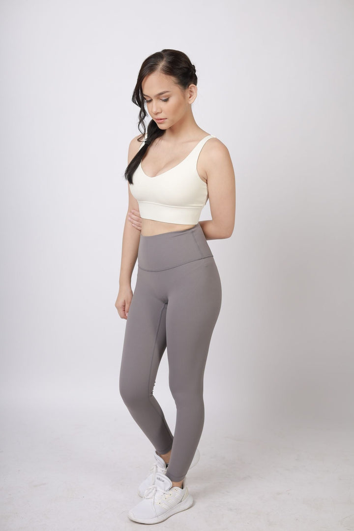 A lady wearing Beauty Lyfe Activewear Scarlett Model Dark Gray Leggings and in sports bra