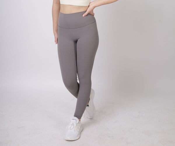 A lady wearing Beauty Lyfe Activewear Scarlett Model Dark Gray Leggings and in sports bra